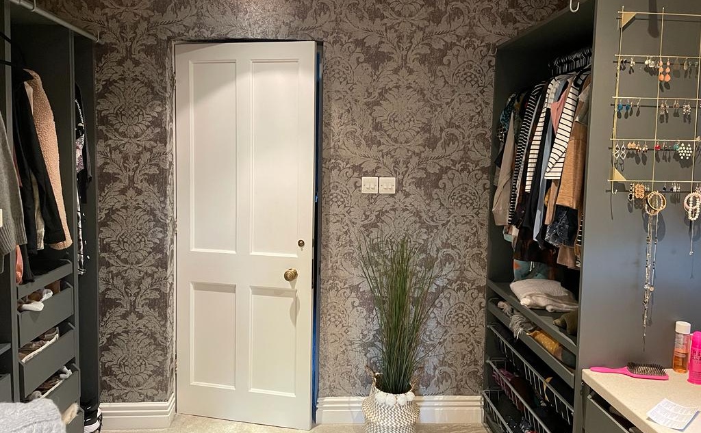 Fresh wallpaper in walk in wardrobe